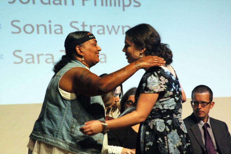 Teena Miranda hugs Sonia Strawn after handing her a scholarship in memory of her son Trey, who passed away last year from brain cancer. BY MATTHEW BERNAT